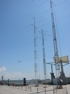 8J1A antenna farm, overlooking Tokyo Bay, with plane on the short base turn into Haneda Airport