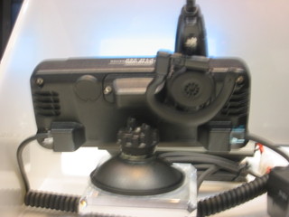 FTM-350 control head rear panel showing dual speakers, charging clip for handsfree headset