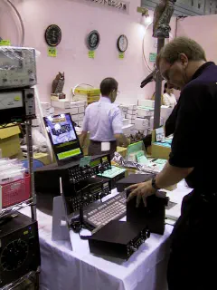 Rob van den Ent, PE9PE, demonstrating the Patcomm transceivers and receiver were available at the JACOM booth.