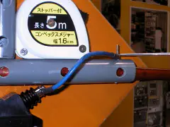 Detailed view of tape measure antenna construction with 5cm hole spacing