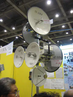 A Christmas tree of microwave gear at the Yokohama Amateur Microwave Association (YAMA) booth.