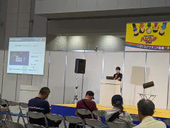 Watanabe-san explaining N.U. Cosmic Campus with the Ten-Koh2 satellite